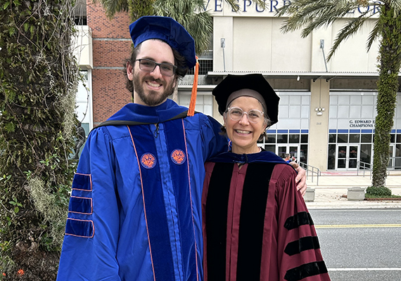doctoral graduate with a professor